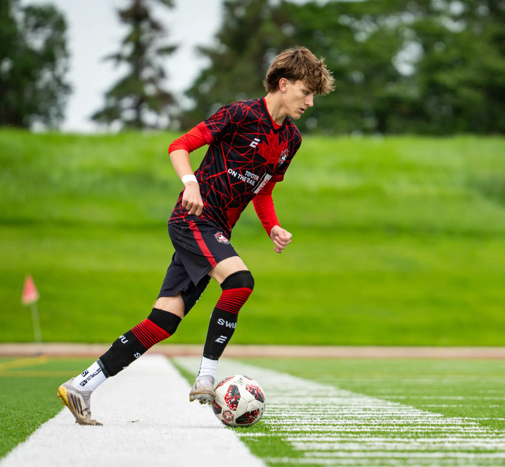 Southwest United player dribbling the ball during a training session